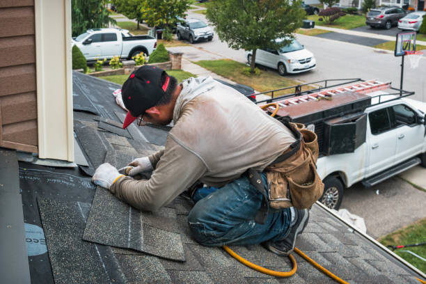 Professional Roofing technician working in Framingham, MA